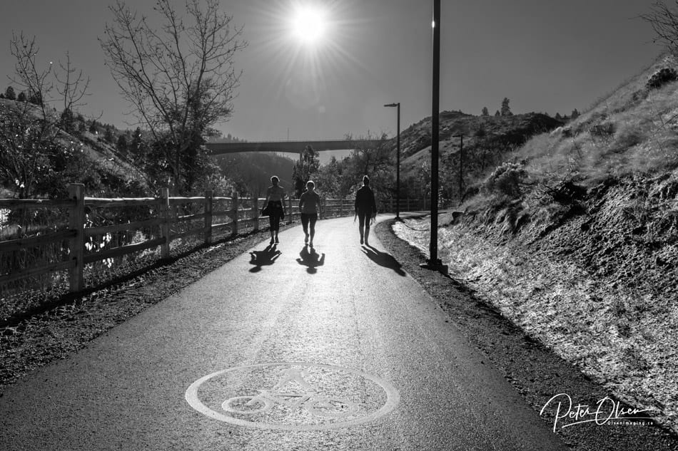 Kamloops grayscale photo of bright sun with road and hikers