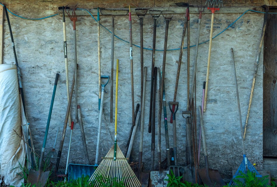 Kamloops rural life shovels and rakes leaning on a wall