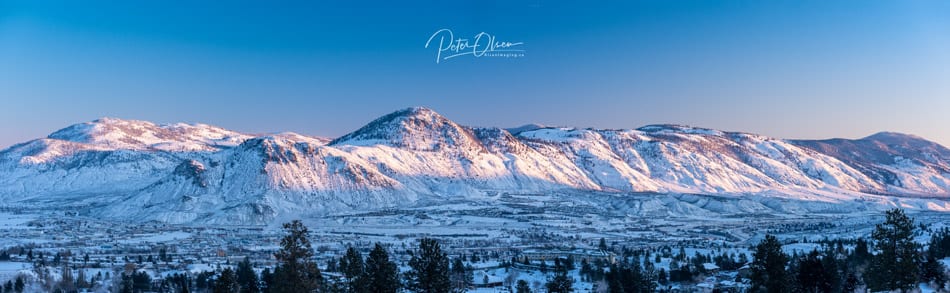 Kamloops City snow-peaked mountain with snow and tree tops