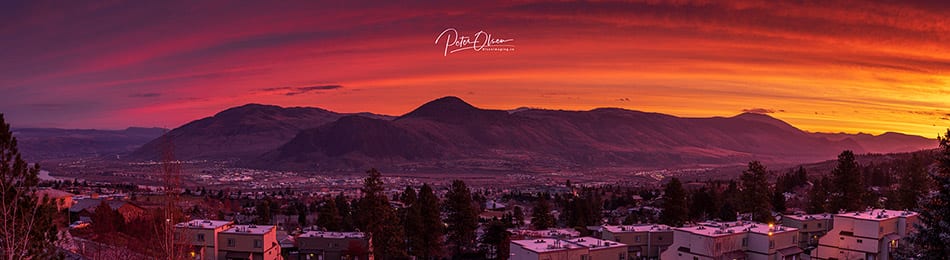 Kamloops City sunlight with purple pink and yellow sky with mountain and city lights 3