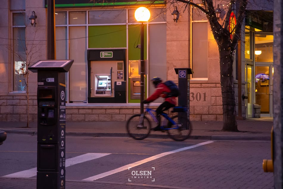 Kamloops City building with cyclist on road