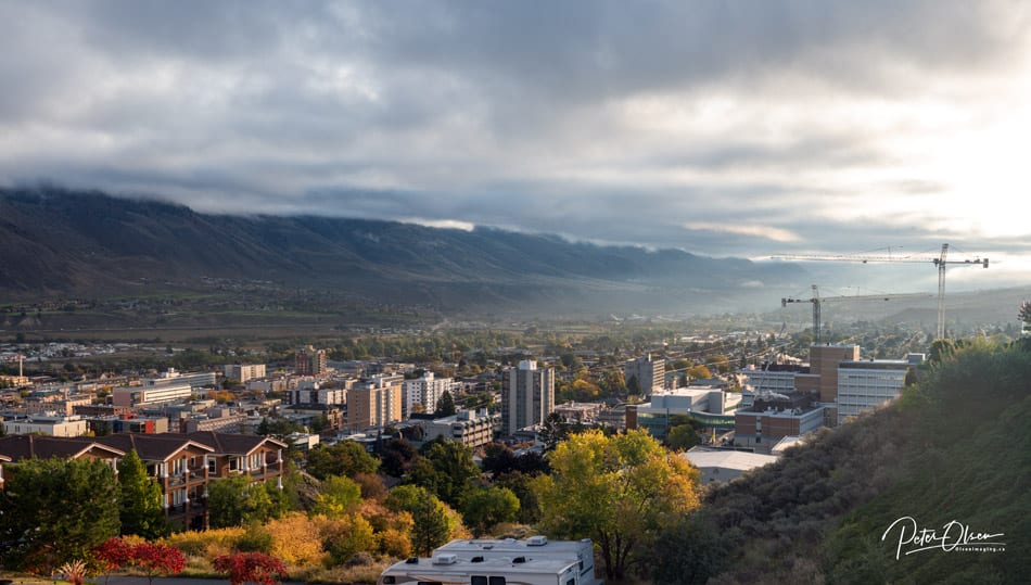 Kamloops City white cloud cover with mountains and trees with buildings
