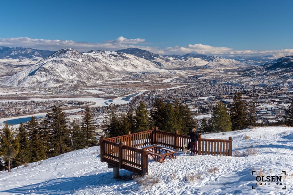 bright blue sky and mountain view with wooden table in the snow