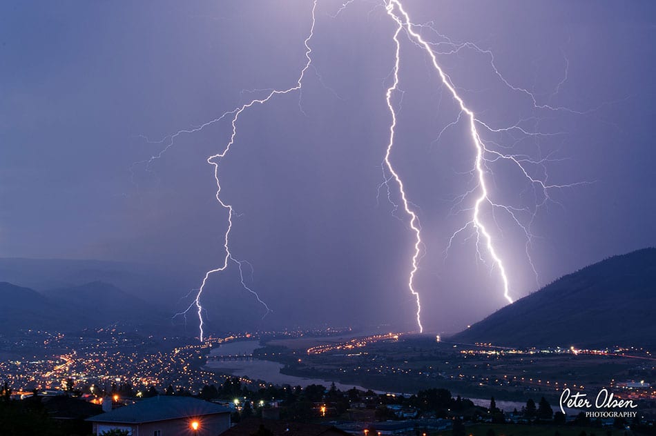 Kamloops city view purple sky with lightning bolts