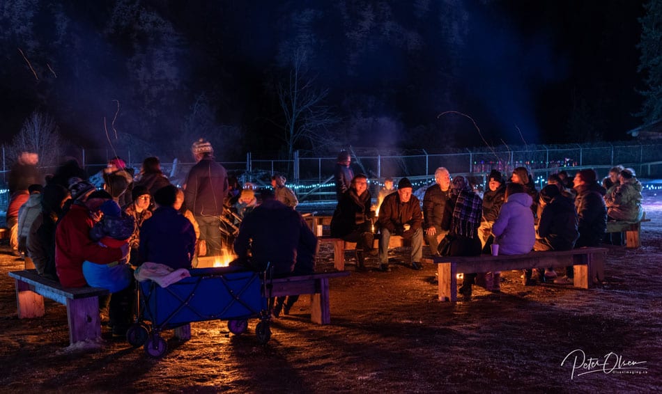 people gathered around campfires