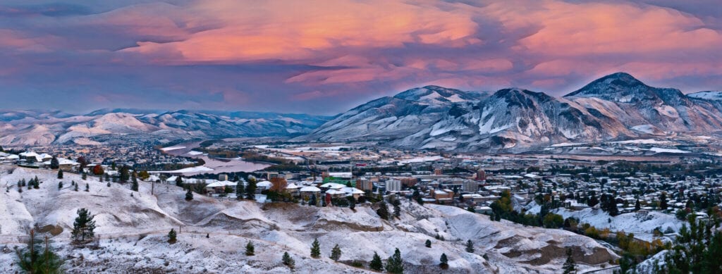 Kamloops Abstract panoramic view of snowy mountains and hills with trees