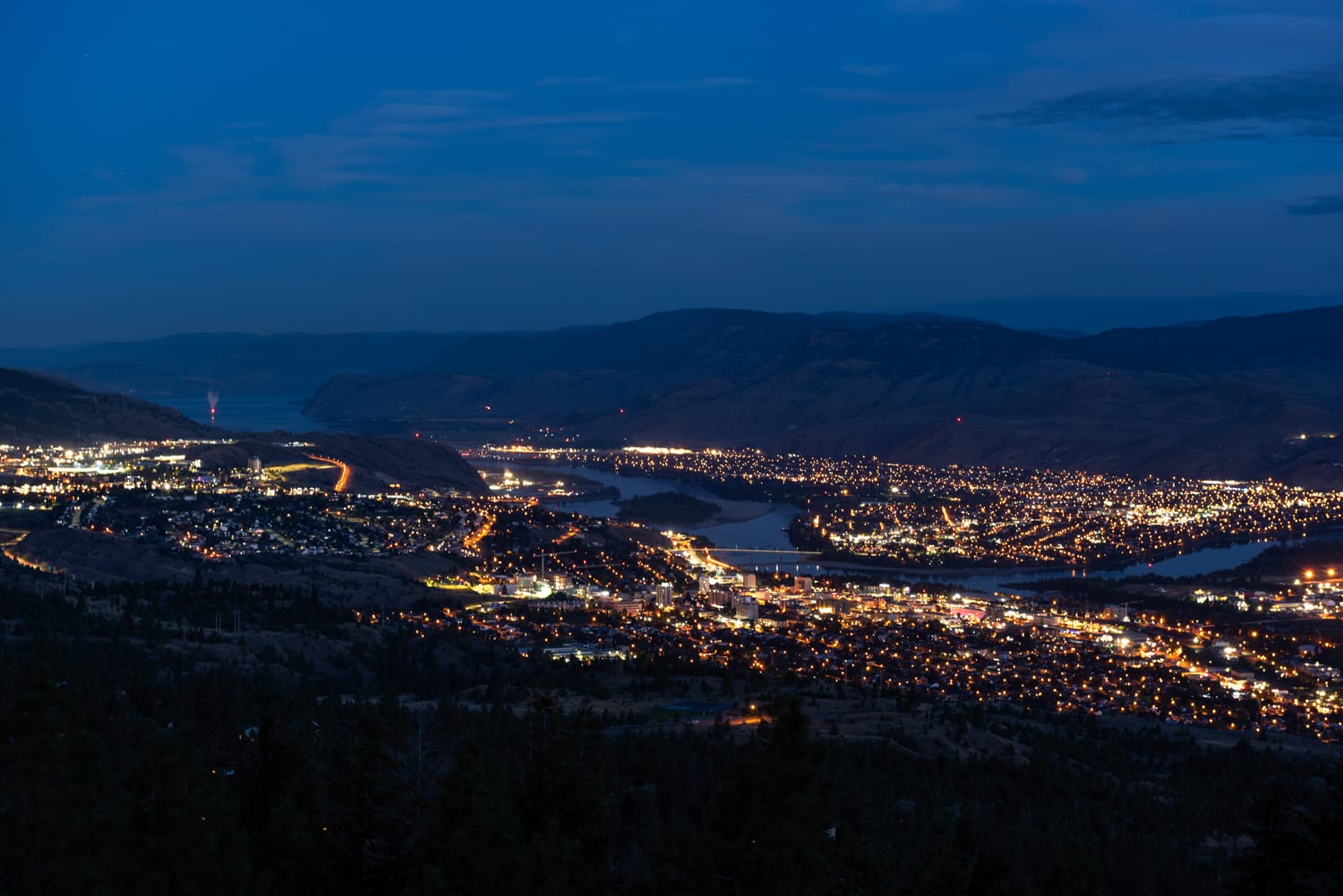 Kamloops City Aerial night sky with mountains and city with bright lights