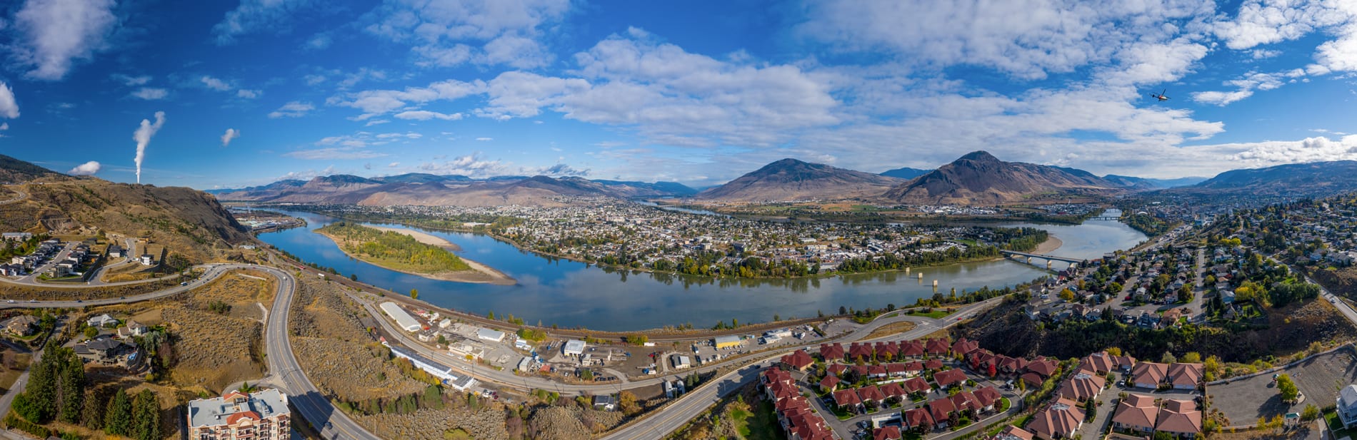 Kamloops City Aerial view of city with trees and mountain with river