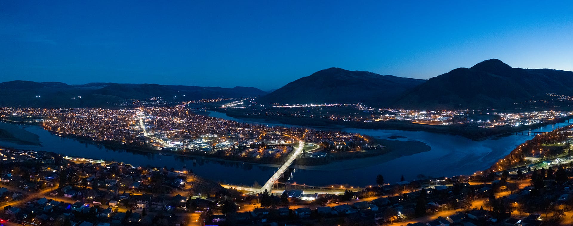 Kamloops City Aerial neon bright lights on road with river