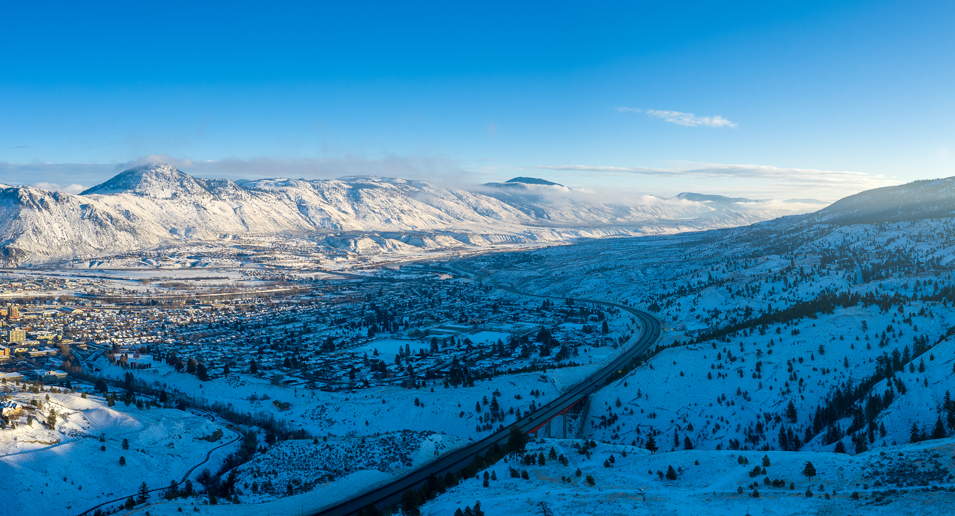 Kamloops City Aerial winding road with buildings and trees with
