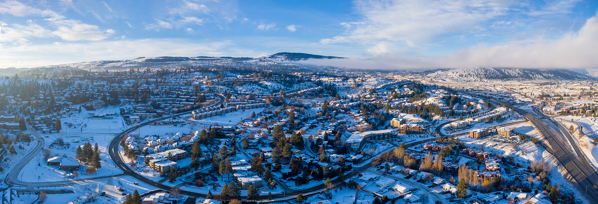 Kamloops City Aerial view of mountains and snow wide angle panoramic