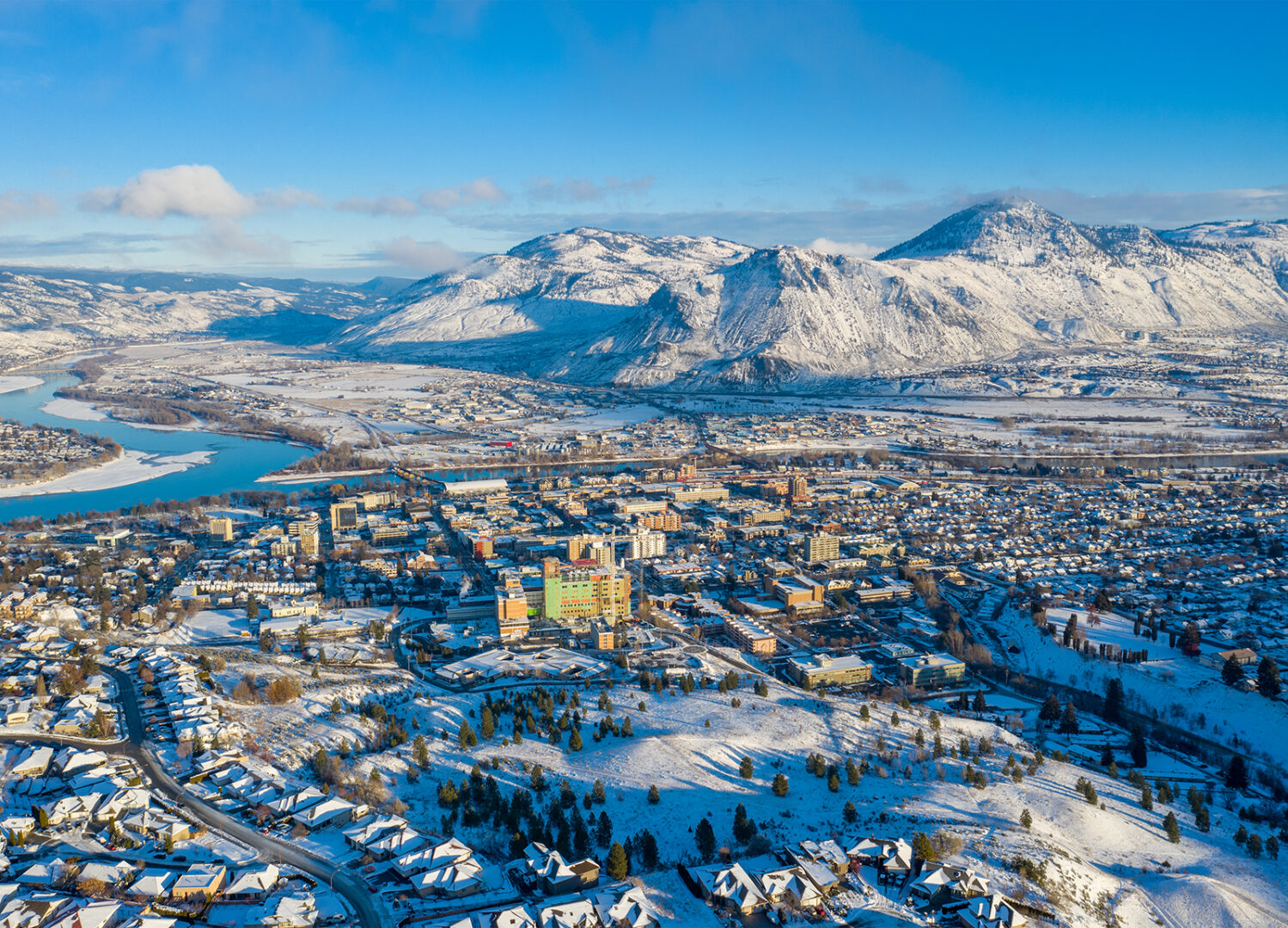 Kamloops City Aerial view with mountains buildings and snow HDR