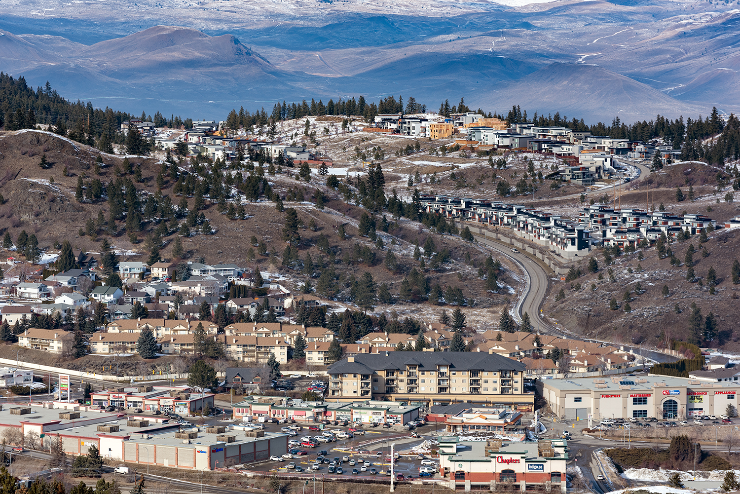Kamloops City with colorful rooftops and mountains with trees