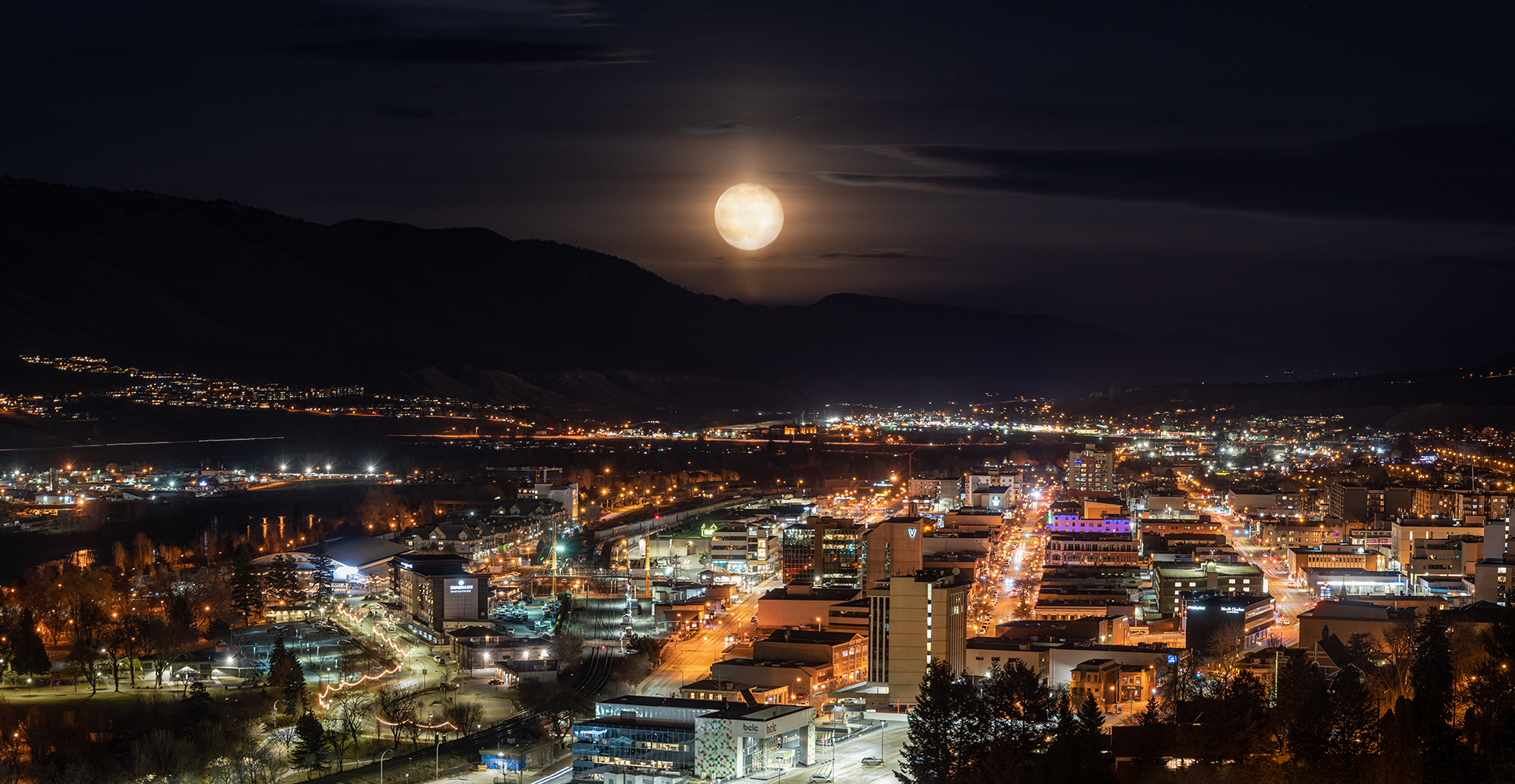 Kamloops City full moon with city and bright lights