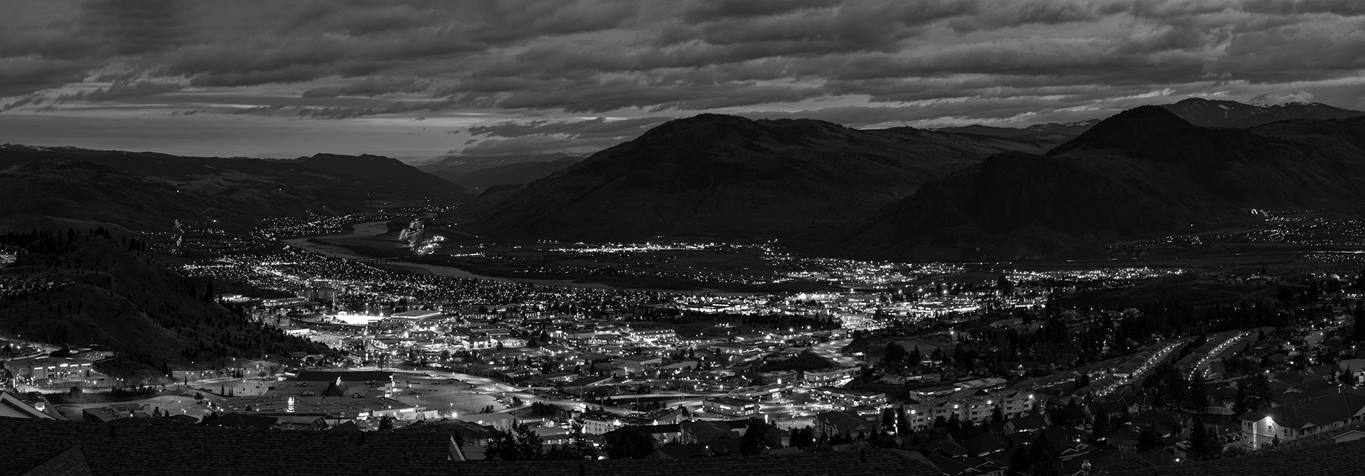 Kamloops panoramic black and white view of mountain and city with lights