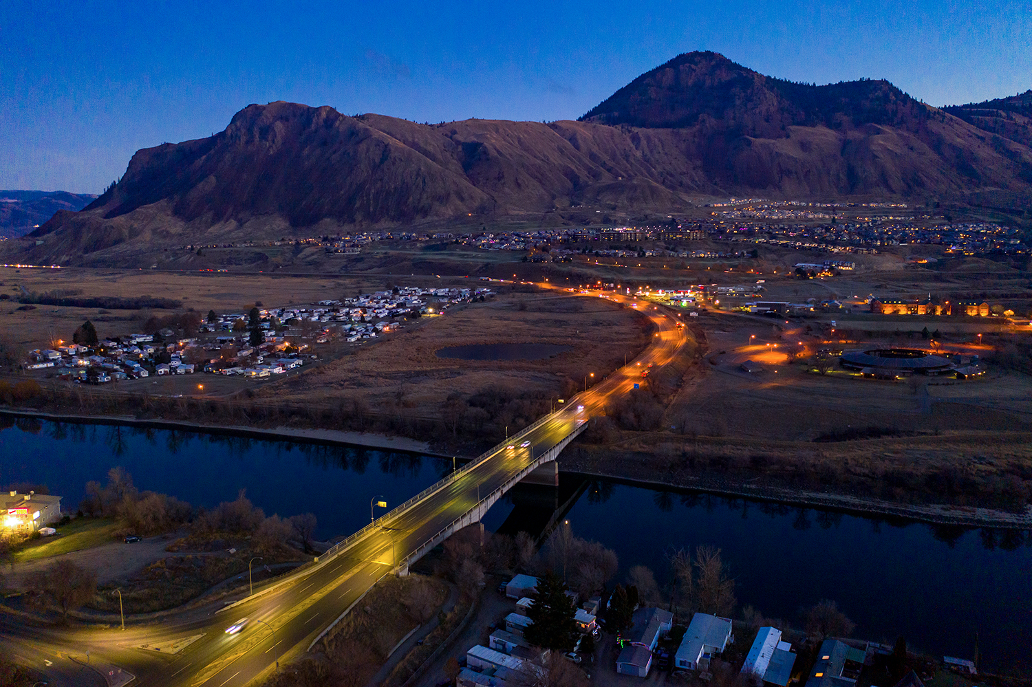 Kamloops City Aerial blue sky and mountains with river and road with cars