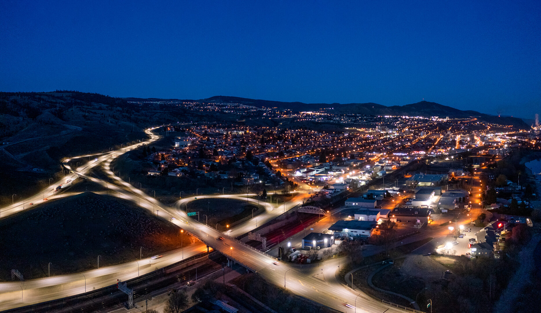 Kamloops City Aerial nighttime view with lights and road closeup