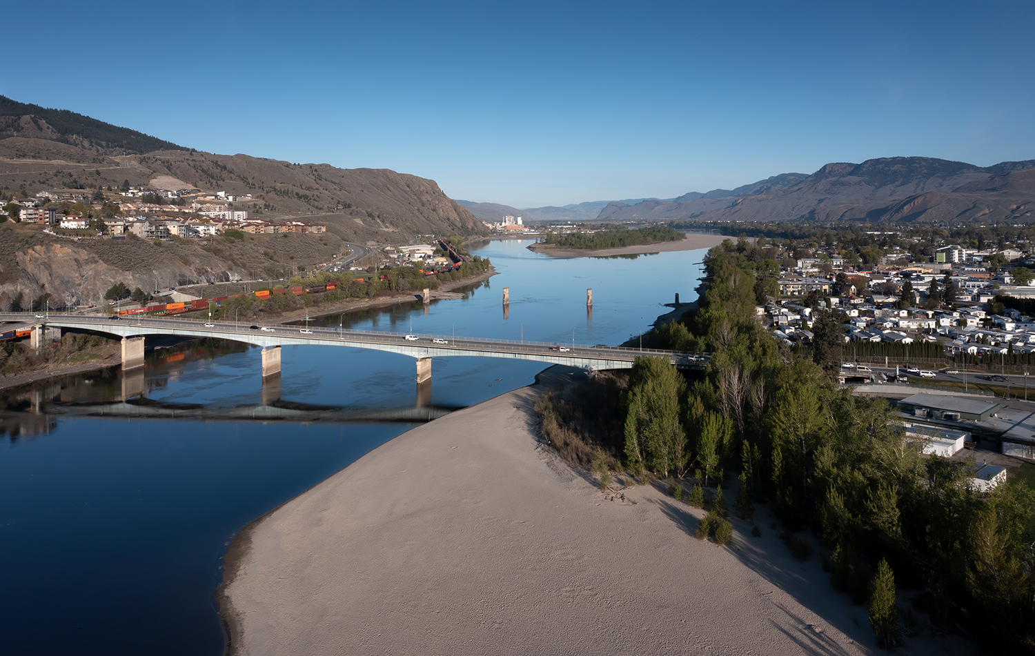 Kamloops City Aerial beach with river and city with tall bridge