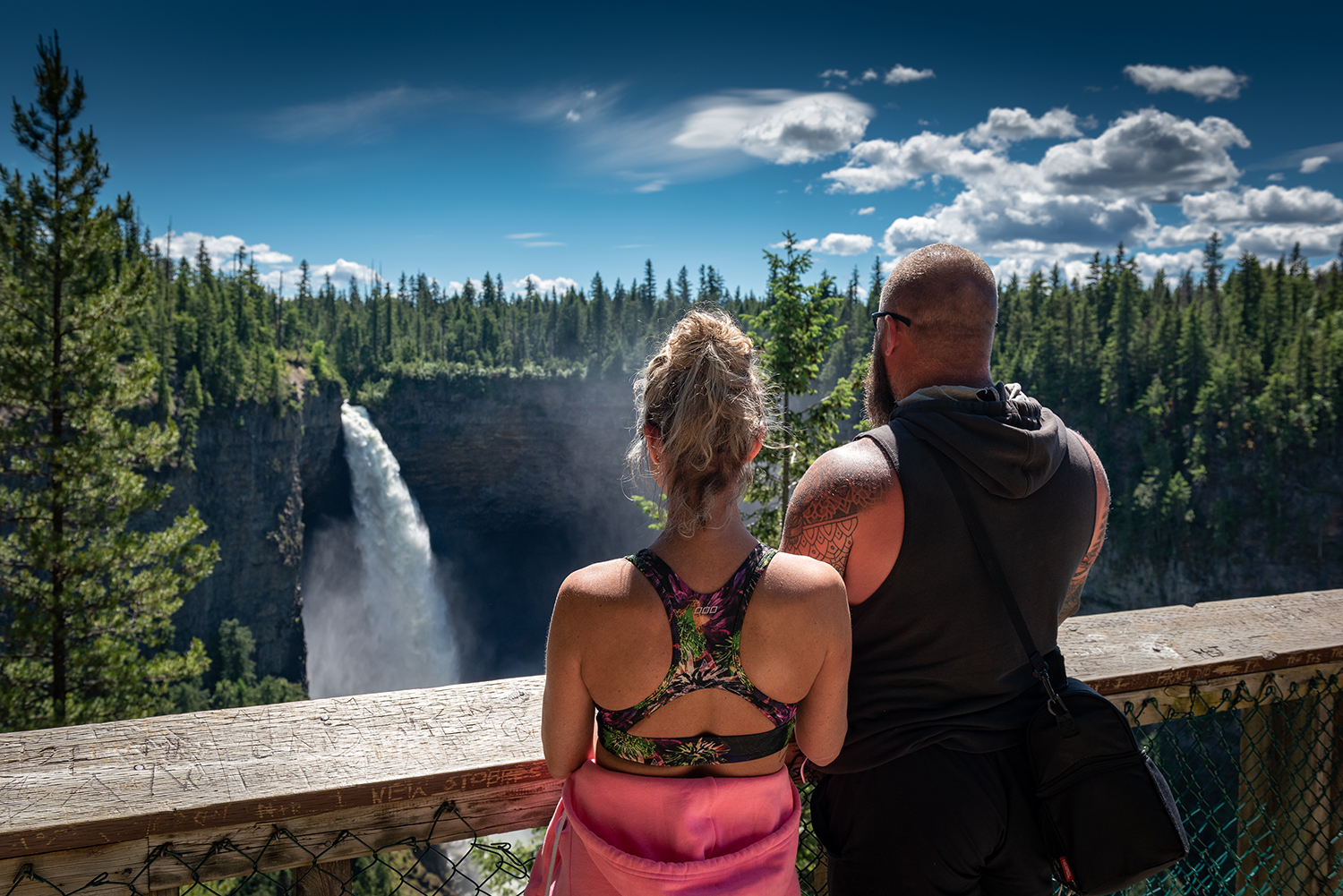 Kamloops Other couple on bridge watching a waterfall