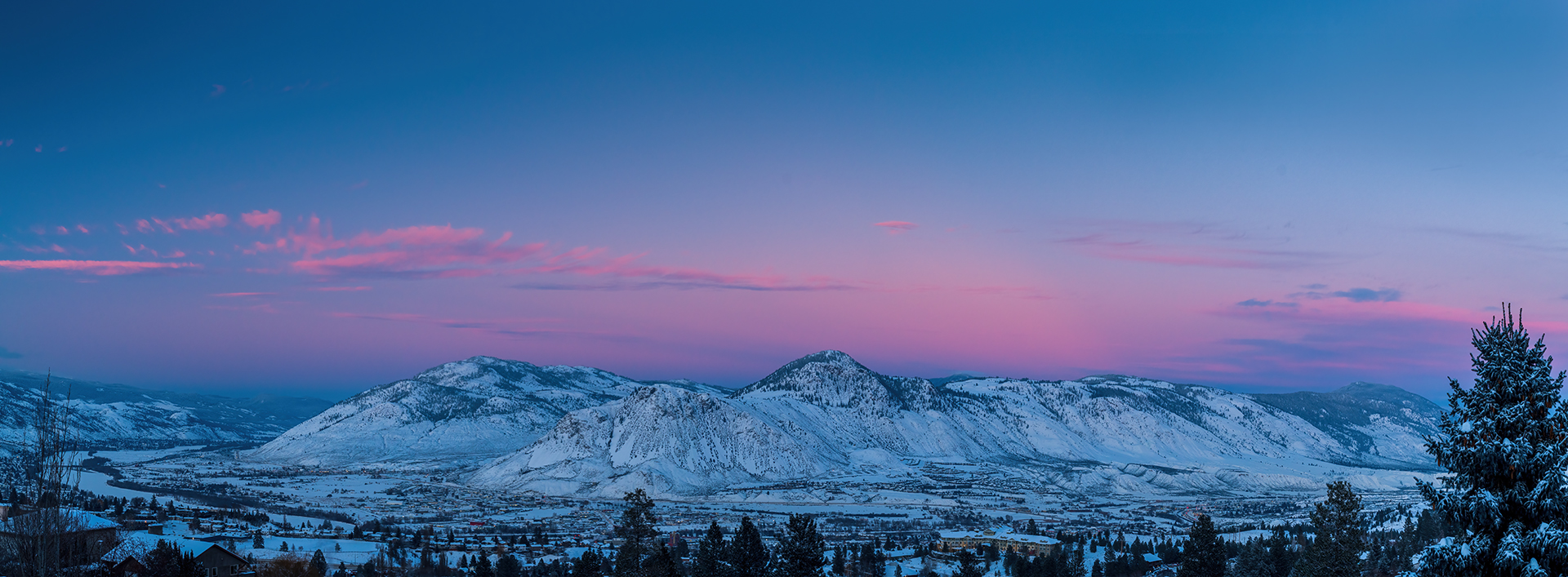 panoramic view of the snowcapped mountain blue pink sky