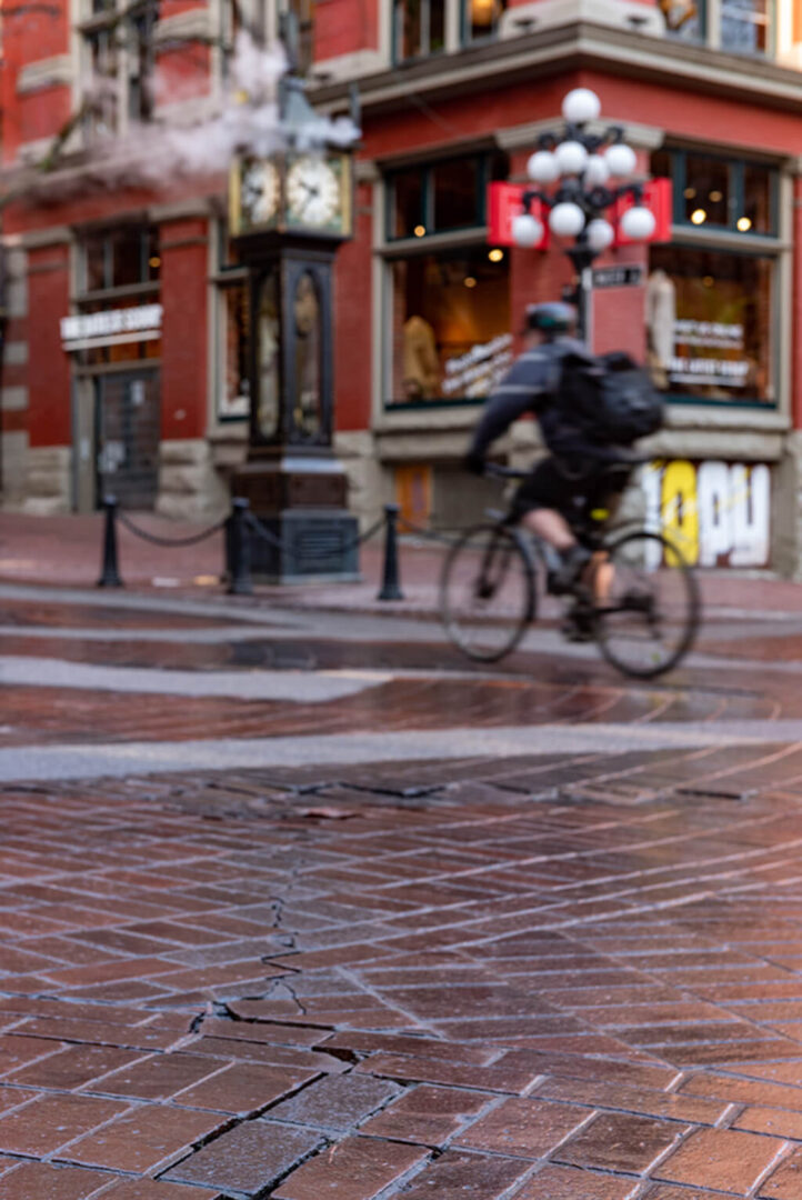 Unfocus picture of a man riding a bicycle on a street