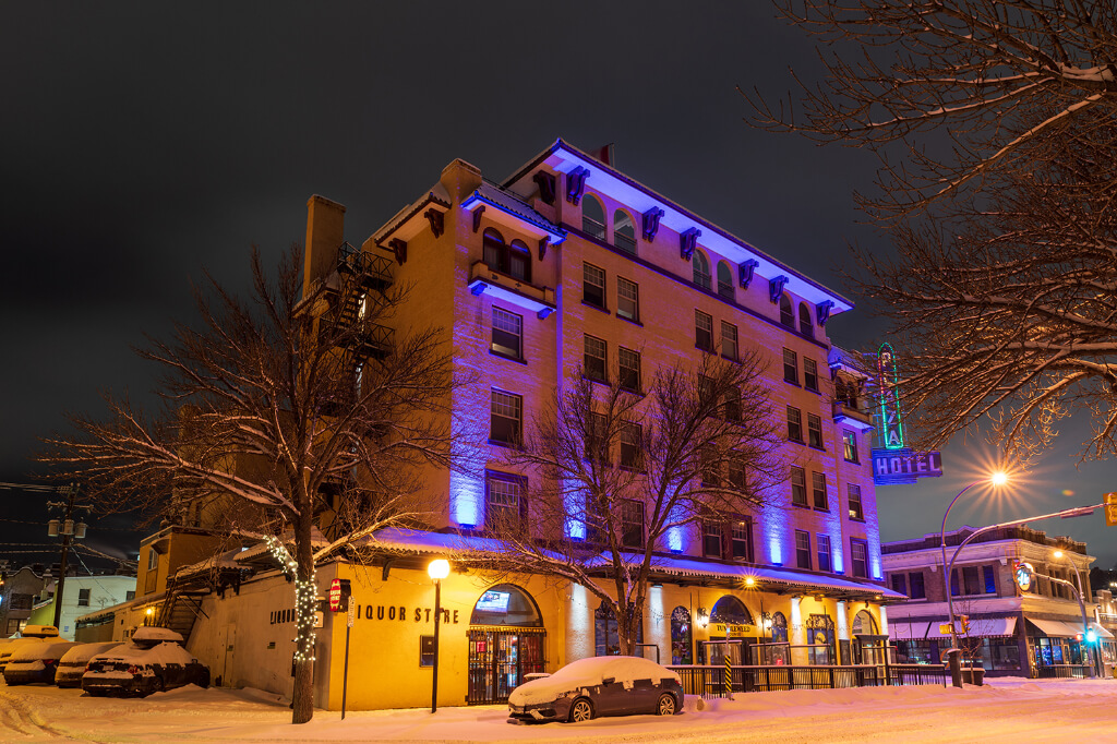 Hotel building with colored lights and dark sky