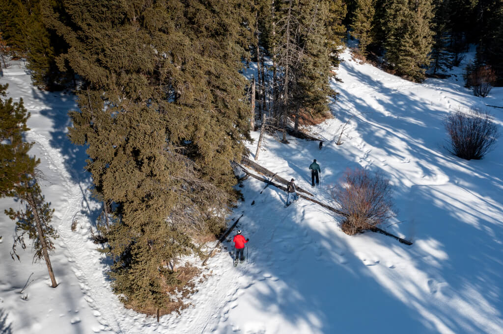 Top view of people walking in the snow on mountains